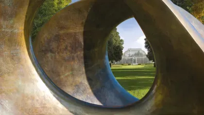 view of the palm house looking through double oval sculpture