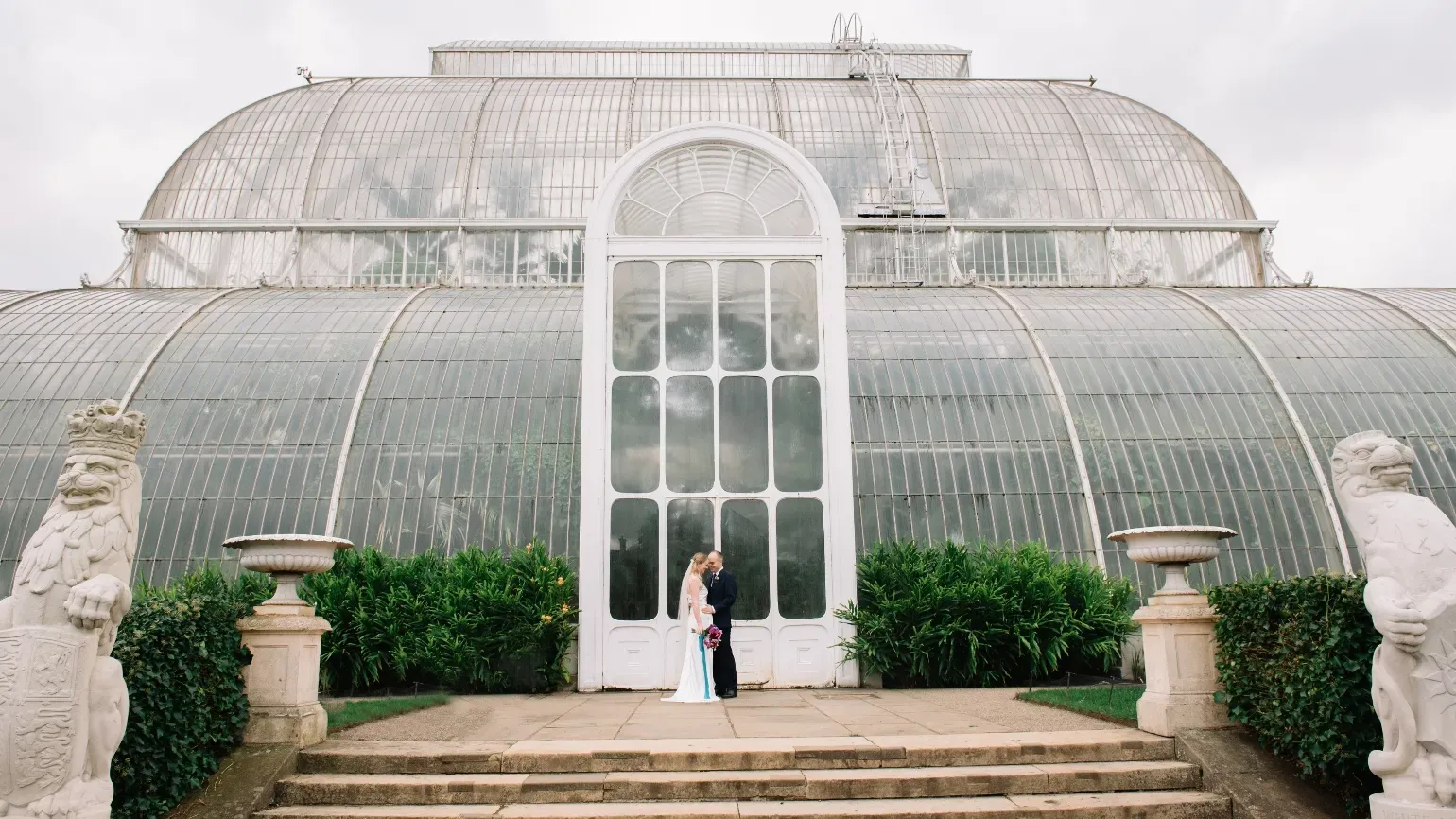Couple photographs at the Palm House