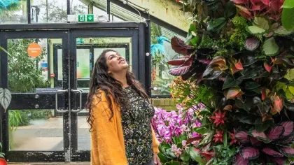Woman admiring orchids display