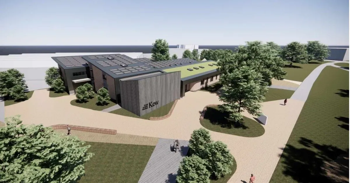 Computer render of a modern building with a grey facade and partial green roof, surrounded by open paths and trees