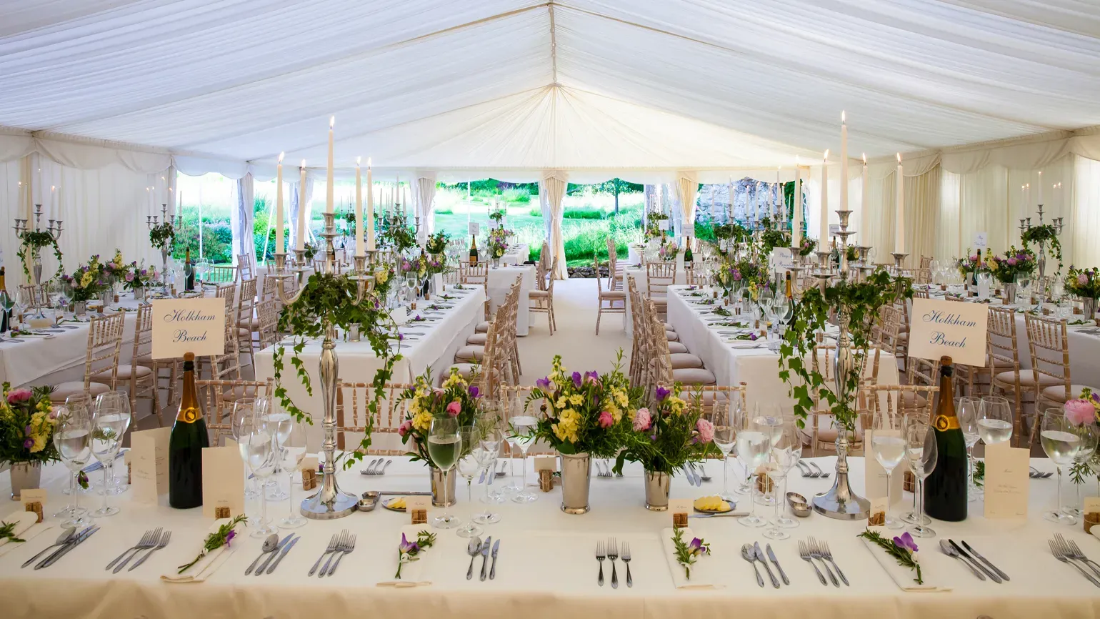 Beautiful table settings in a wedding marquee at Wakehurst